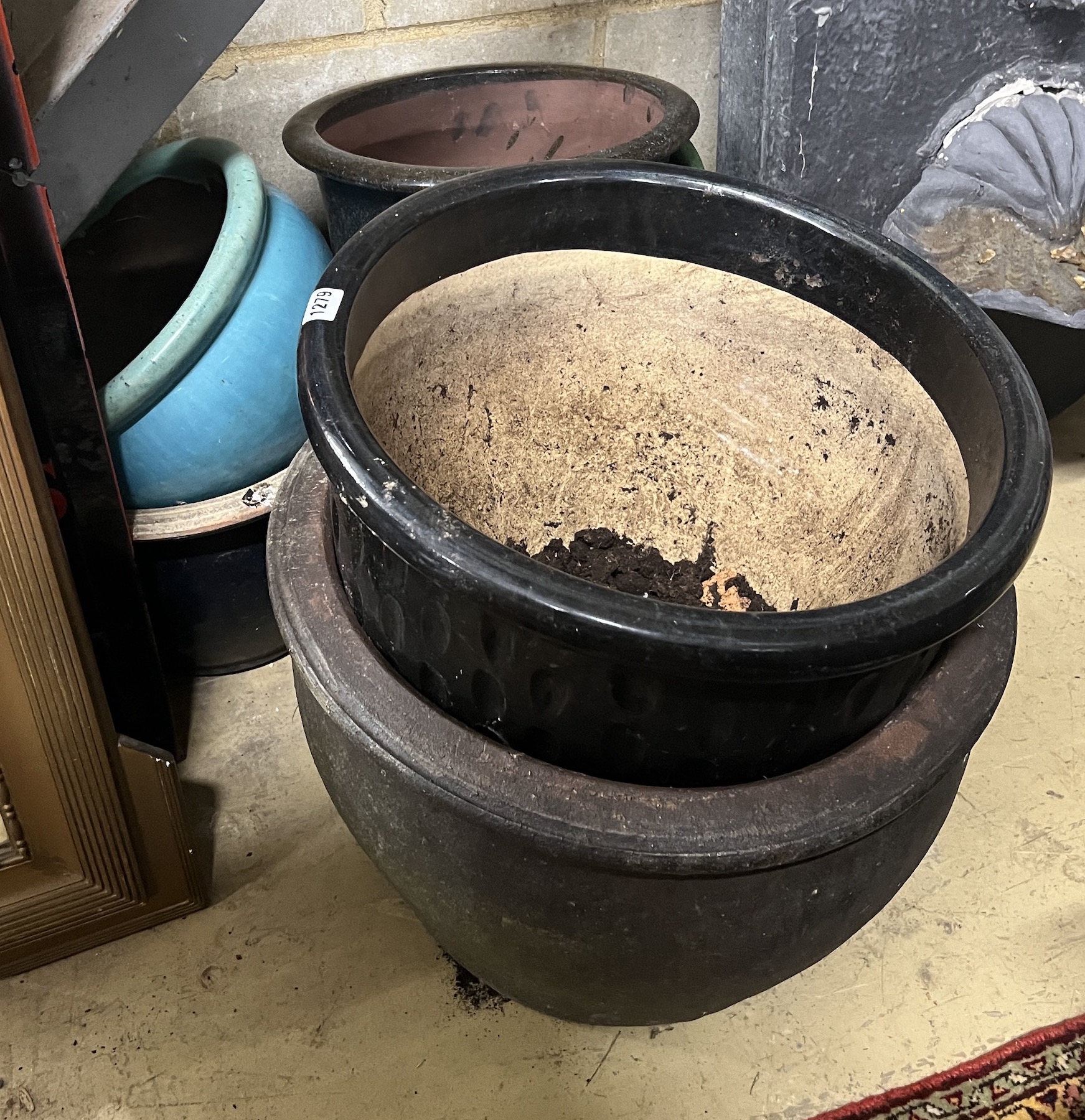 Seven assorted glazed earthenware garden planters, largest diameter 45cm, height 37cm
